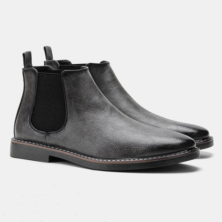 Zijkant grijze klassieke chelsea boots voor dames